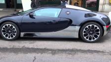 TWO Bugatti Veyrons in daylight outside Four Seasons in Geneva, Switzerland March 2013